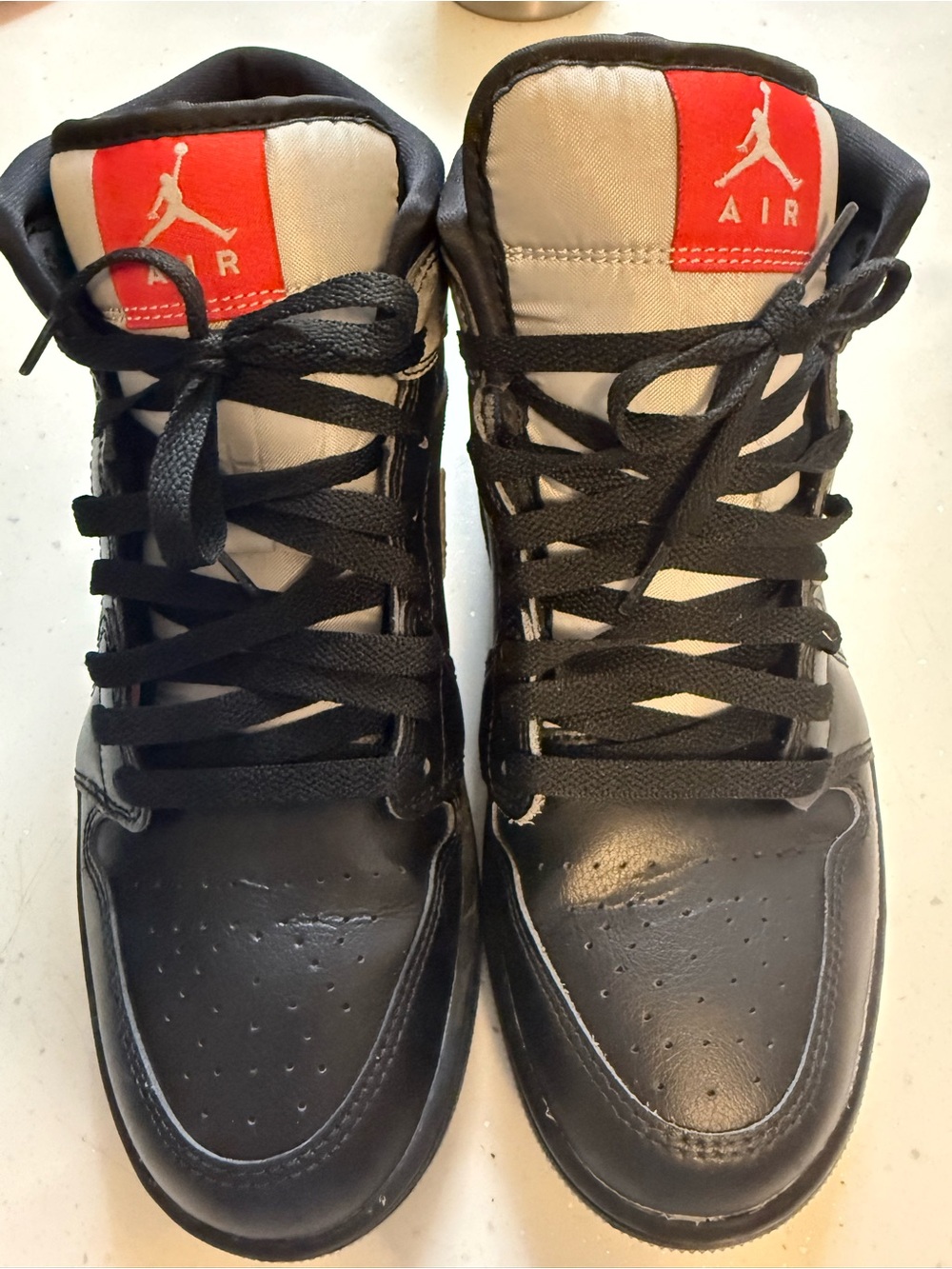 Jordan Black and White High-Top Sneakers with Red Tongue Patch